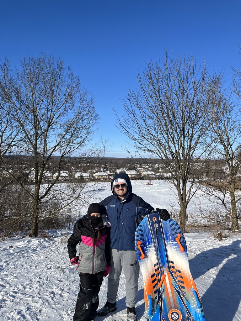 papa e hija en la nieve